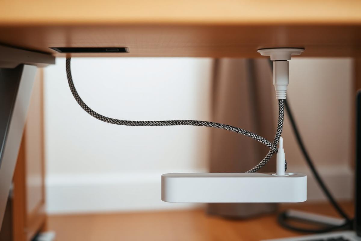 Tidy desk with hidden cables and a single visible USB-C cable